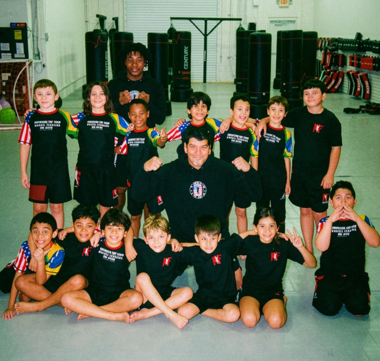 Coach Marcel with kids — serving Clermont families