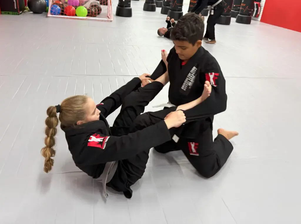 Kids practicing focus and form during martial arts session