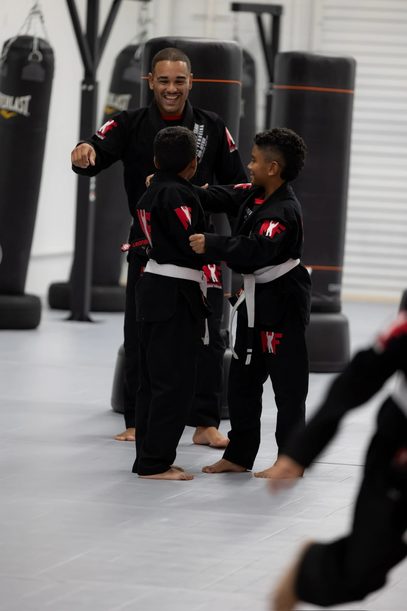 Coach Marcel Ferreira with young students at ATT Winter Garden
