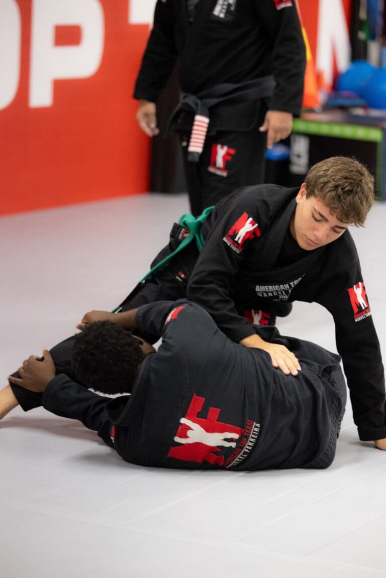 Teens performing a Jiu-Jitsu technique with confidence