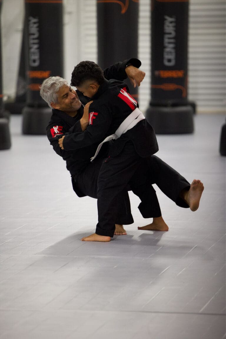Kid showing Jiu-Jitsu movement and technique during class.